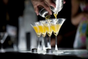 bartender pouring cocktails