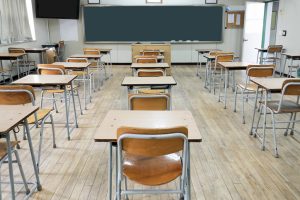 rows of empty desks in a school