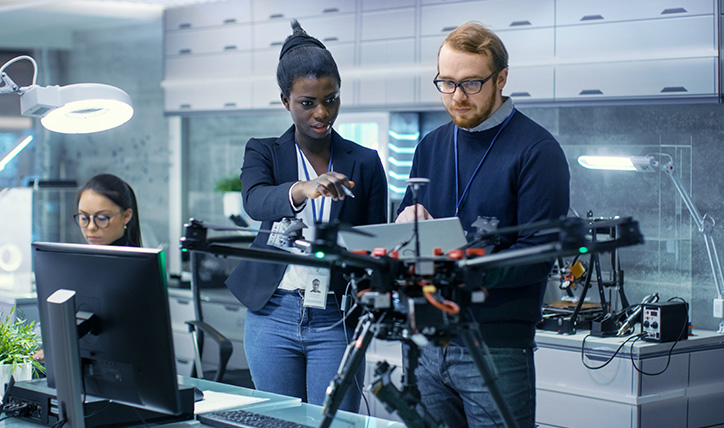 woman and man looking at something on computer