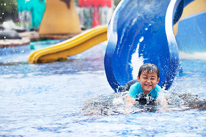 child going down waterslide