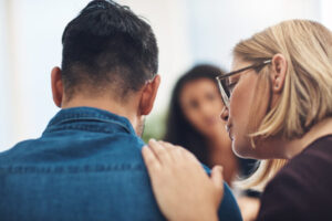 woman consoling man